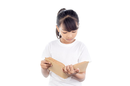 Lovely Little Girl Standing And Reading Book Isolated On White Background With Clipping Path.