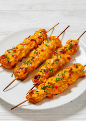 Bang Bang Chicken Skewers on plate, top view