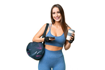 Young sport woman with sport bag over isolated chroma key background holding coffee to take away...