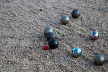 Petanque game. You can see the steel balls of different colors and the magnet they use to collect...