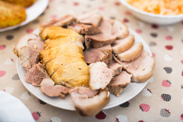Cold cuts of different types of cooked meat on plate
