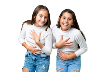 Friends girls holding gift and a birthday cake over isolated chroma key background smiling a lot while putting hands on chest