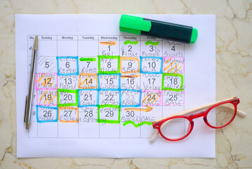 Calendar with business appointments,pen and spectacles, monthly schedule