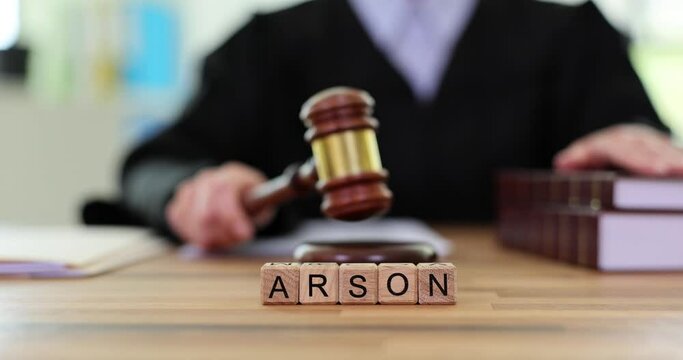 Word arson is judge pronouncing verdict in court. Deliberate arson and judgment