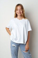 Obraz premium Portrait of young beautiful cute teen girl posing at camera