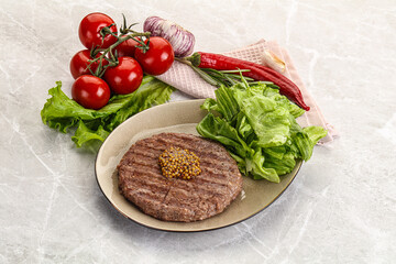 Frilled beef burger cutlet with iceberg