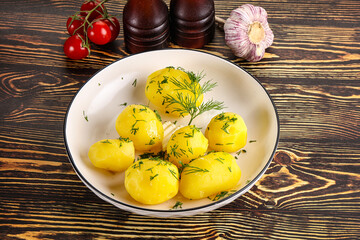Boiled potato with oil and dill
