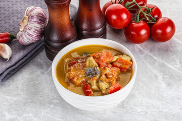 Traditional yellow Thai curry with chicken