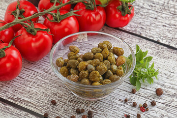 Marinated green capers in the bowl