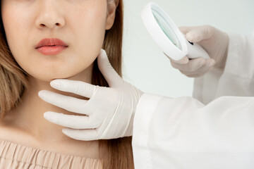 Young woman asian are worried about faces Dermatology and allergic to steroids in cosmetics. sensitive skin, red face from sunburn, acne, allergic to chemicals, rash on face. skin problems and beauty