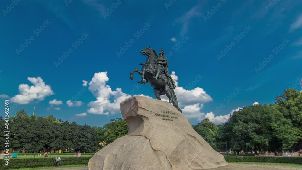 Wall mural Bronze Horseman Monument Timelapse Hyperlapse in Saint Petersburg, Russia. Majestic View of Russian Emperor Peter the Great Statue with Blue Cloudy Sky and Green Trees as Background