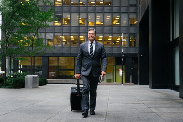 Senior businessman wearing elegant suit in New York - Handsome mature adult business manager strolling in the city