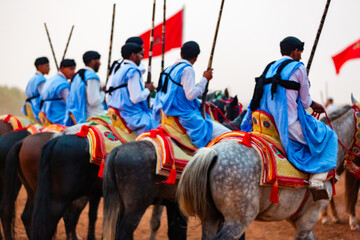 Equestrians participating in a traditional fancy dress event named Tbourida in Arabic dressed in a...