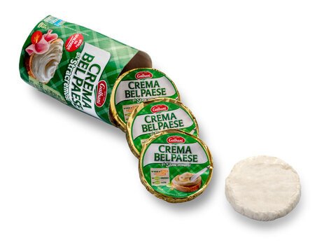 italy - august 08, 2023: cream Belpaese Galbani, box with packets of cream cheese and discarded product, isolated on white with clipping path