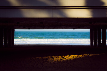 Beach through the bridge