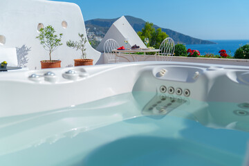 Plakat Luxurious hot tub with sea view at terrace