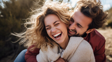Happy young couple smiling and laughing - obrazy, fototapety, plakaty