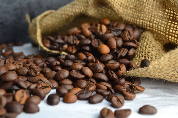 there are coffee beans in burlap on the table