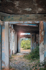 Fototapeta na wymiar Entrance of the old abandoned ruined building