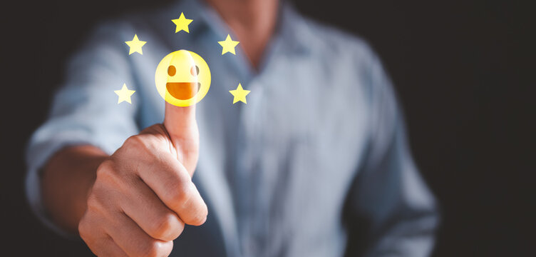 Customer satisfaction concept. Man thumbs up on smiley face and five gold star, give positive feedback or rating.