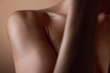 Healthy, skin and body closeup on woman, shoulder or natural glow and skincare texture in studio...