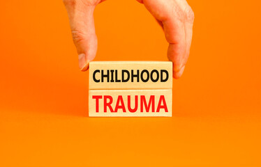Childhood trauma symbol. Concept words Childhood trauma on beautiful wooden blocks. Beautiful...