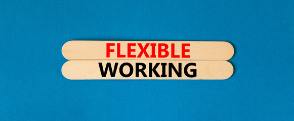 Flexible working symbol. Concept words Flexible working on beautiful wooden stick. Beautiful blue table blue background. Business flexible working concept. Copy space.