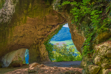 View of the natural bridge with two breakthroughs on the Houbirg near Happurg/Germany