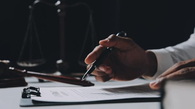 Business and lawyers discussing contract papers with brass scale on desk in office. Law, legal services, advice, justice and law concept picture with film grain effect