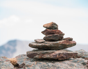 Cairns, carefully arranged stacks of stones on mountain ridge