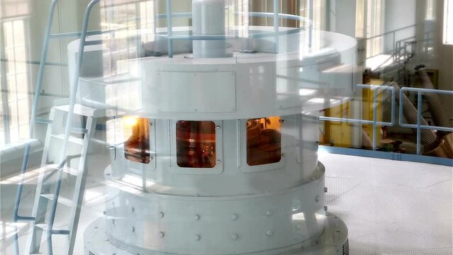 Powerful Rotation: 4K Video of Electric Turbine Generator Turning in Hydro Power Dam