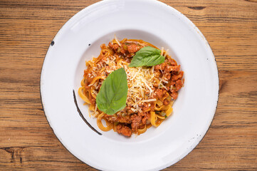 Traditional gourmet pasta flat lay. Overhead view of a plate of pasta with delicious sauce. Italian food concept. traditional pasta