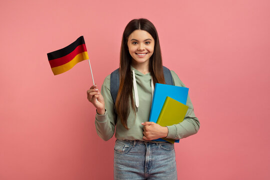 International Education. Beautiful Female Student With Backpack Holding German Flag