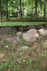 Old worn and weathered concrete foundation of an abandoned home.