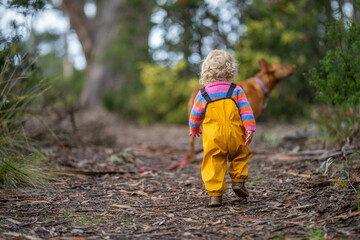 toddler in the forest exploring the environment