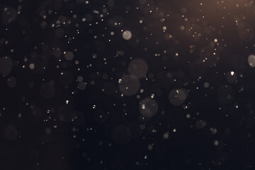small drops of rain, snow on a black background. wind. Natural background