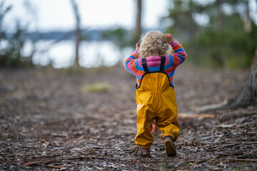 toddler in the forest exploring the environment