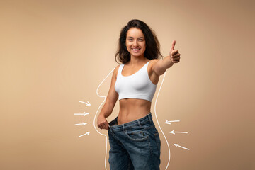 Results of diet, slim middle eastern woman wearing big jeans