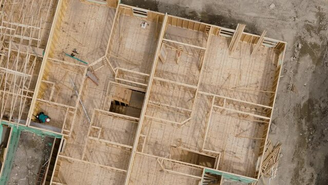 Construction of house. wooden frame of family construction site. Aerial above footage.