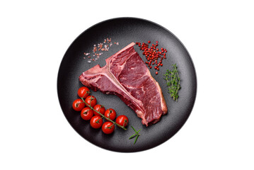 Raw juicy beef t-bone steak with salt, spices and herbs