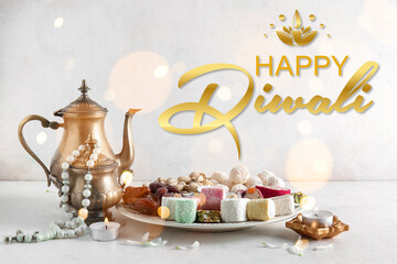 Greeting card for Happy Diwali (Festival of lights) with Indian sweets, teapot and glowing candles