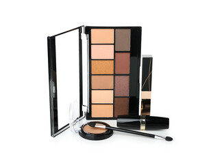 Decorative cosmetics with brush on white background