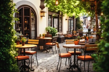 Fototapeta na wymiar Cafe terrace with tables and chairs in european city