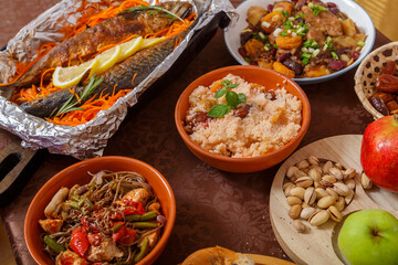 Festive table for Rosh Hashanah with traditional treats.