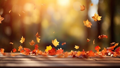 Naklejka na ściany i meble Autumn leaves falling on a wooden table