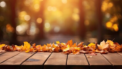 Obraz na płótnie Canvas Autumn leaves falling on a wooden table