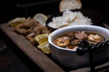 Seafood gumbo with rice and crab fingers.