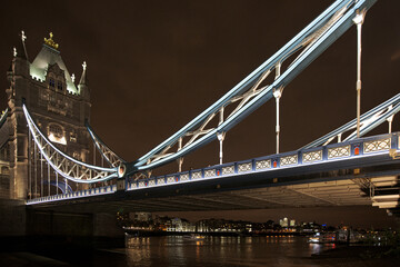 Iconic Tower Bridge seen at night, linking London with Southwark on the River Thames.