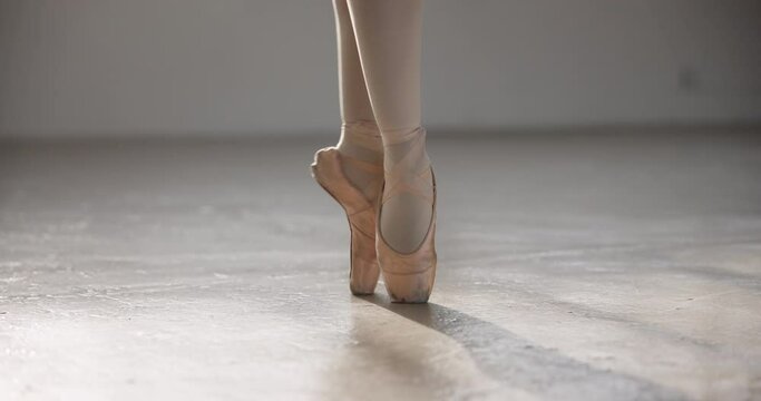 Shoes, ballerina and legs in performance, dance or professional moving in competition. Ballet, woman and pointe of creative person in art training, balance workout or exercise for fitness in closeup