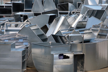 Piles of the ventilation ducts made of galvanized steel.